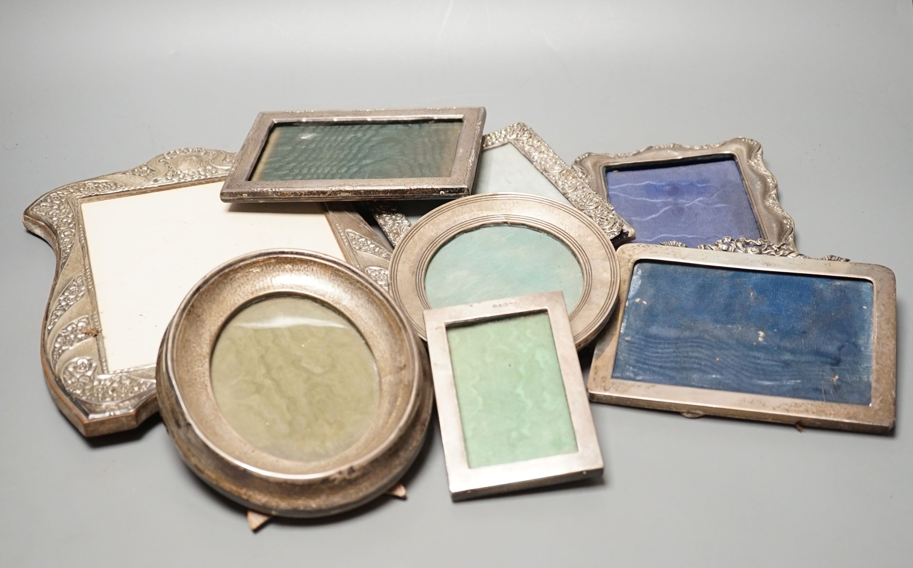 A mixed group of eight various small silver mounted photograph frames, largest 29cm and dated for Birmingham, 1911.